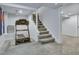 Spacious basement area with a treadmill and stairs leading to the upper level at 350 Albion St, Denver, CO 80220
