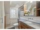 Modern bathroom with granite countertop and wood cabinets at 350 Albion St, Denver, CO 80220