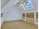 Bright attic bedroom with a skylight, hardwood floors, and built-in storage at 350 Albion St, Denver, CO 80220
