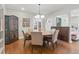 Dining room with a wooden table, upholstered chairs, and hardwood floors at 350 Albion St, Denver, CO 80220