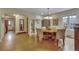 Open dining room with hardwood floors, decorative cabinet, and seamless flow to other spaces at 350 Albion St, Denver, CO 80220