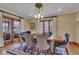 Elegant dining room with stylish chairs, chandelier, and a view to the backyard at 350 Albion St, Denver, CO 80220