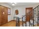Welcoming entryway with hardwood floors, decorative mirror, window, and stylish staircase at 350 Albion St, Denver, CO 80220
