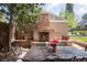 Outdoor brick fireplace with a dining table and chairs, perfect for outdoor entertaining at 350 Albion St, Denver, CO 80220