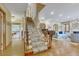 Spacious foyer with staircase, hardwood floors, and views into the elegant living spaces at 350 Albion St, Denver, CO 80220