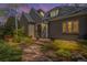 Stunning front exterior with manicured garden at dusk at 350 Albion St, Denver, CO 80220