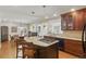 Bright kitchen with a center island, breakfast bar, and wood cabinets at 350 Albion St, Denver, CO 80220