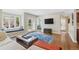Bright living room with hardwood floors and a white sectional sofa at 350 Albion St, Denver, CO 80220