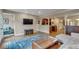 Bright living room with an open layout, hardwood floors and a large area rug at 350 Albion St, Denver, CO 80220