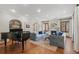 Elegant living room with a grand piano, cozy seating, and a marble fireplace at 350 Albion St, Denver, CO 80220