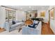 Bright and open living room with hardwood floors, comfortable sofas, and a grand piano at 350 Albion St, Denver, CO 80220