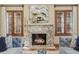 Cozy living room with a marble fireplace, bright windows, and comfortable seating at 350 Albion St, Denver, CO 80220