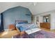 Comfortable main bedroom featuring a plush bed, stylish decor, and hardwood floors at 350 Albion St, Denver, CO 80220