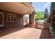 Covered brick patio with a built-in grill, creating an inviting outdoor cooking and dining space at 350 Albion St, Denver, CO 80220