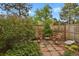 Private backyard nook with bistro set and lush landscaping offers a serene outdoor retreat at 7882 S Valentia Way, Centennial, CO 80112