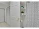 Bathroom featuring shelves and shower with curtain at 7882 S Valentia Way, Centennial, CO 80112