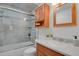 Bathroom featuring a tiled shower and sink with vanity at 7882 S Valentia Way, Centennial, CO 80112
