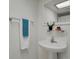 Bathroom featuring a pedestal sink and mirror at 7882 S Valentia Way, Centennial, CO 80112