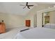 Large bedroom with vaulted ceiling, ceiling fan, and dresser at 7882 S Valentia Way, Centennial, CO 80112