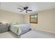 Bedroom features a queen-sized bed and a wooden window at 7882 S Valentia Way, Centennial, CO 80112