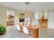 Cozy dining area next to kitchen with stylish pendant lighting and open to the stairs at 7882 S Valentia Way, Centennial, CO 80112