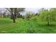 Lush green space with a small stream flowing through a tranquil setting at 7882 S Valentia Way, Centennial, CO 80112