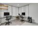 Functional home office space featuring built in shelving and two desk areas perfect for working at home at 7882 S Valentia Way, Centennial, CO 80112