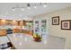 Gourmet kitchen with a large island, stainless steel appliances, and abundant counter space at 7882 S Valentia Way, Centennial, CO 80112