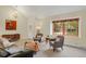 Inviting living area with plush seating, ample natural light, and stylish decor at 7882 S Valentia Way, Centennial, CO 80112