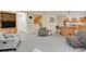 Open-concept living room with a fireplace and a staircase at 7882 S Valentia Way, Centennial, CO 80112
