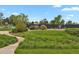 Well-maintained community park featuring a playground and tennis court at 7882 S Valentia Way, Centennial, CO 80112