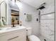 Modern bathroom with a stylish vanity, marble shower, and contemporary fixtures at 1103 S Monaco Pkwy, Denver, CO 80224