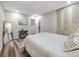 Bright bedroom featuring a comfortable bed, modern decor, and ample closet space at 1103 S Monaco Pkwy, Denver, CO 80224