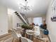 Dining area is designed for modern style, with an open staircase and bright, natural light at 1103 S Monaco Pkwy, Denver, CO 80224