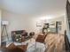 Spacious open-concept living area offers modern dining and comfortable seating, perfect for relaxing and entertaining at 1103 S Monaco Pkwy, Denver, CO 80224