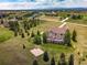 Sprawling estate featuring a lush green lawn and picturesque neighborhood views at 19735 Knights Xing, Monument, CO 80132