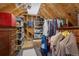 This attic space provides plenty of storage with shelving and hanging racks for organizing belongings at 19735 Knights Xing, Monument, CO 80132