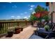 View of the outdoor deck with patio furniture overlooking a green lawn at 19735 Knights Xing, Monument, CO 80132