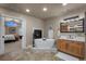 Bright bathroom with a soaking tub, a fireplace, and a marble countertop vanity at 19735 Knights Xing, Monument, CO 80132