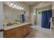 Bright bathroom with double sinks, granite countertops, and a separate tub and shower at 19735 Knights Xing, Monument, CO 80132