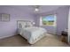 Cozy bedroom with a ceiling fan, natural light from a window, and neutral carpet that creates a calm atmosphere at 19735 Knights Xing, Monument, CO 80132