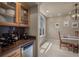 Butler's pantry with wine fridge adjoins the dining area at 19735 Knights Xing, Monument, CO 80132