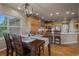 A view from the dining room showing access to a modern kitchen at 19735 Knights Xing, Monument, CO 80132