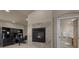 Cozy fireplace adjoining an office space, perfect for relaxing or working at 19735 Knights Xing, Monument, CO 80132