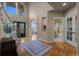 Elegant foyer with hardwood floors, staircase, and a view into adjoining rooms at 19735 Knights Xing, Monument, CO 80132