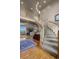 Sweeping staircase with decorative railings and a glimpse into the living space beyond at 19735 Knights Xing, Monument, CO 80132