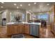 The kitchen island offers additional counter space and seating, while connecting to dining and living spaces at 19735 Knights Xing, Monument, CO 80132