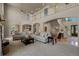 Open concept living area with plenty of space, high ceilings, and natural light at 19735 Knights Xing, Monument, CO 80132