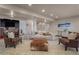 Inviting living room featuring recessed lights, neutral carpet, modern sofa and leather chairs at 19735 Knights Xing, Monument, CO 80132