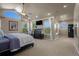Large main bedroom featuring many windows, vaulted ceilings, and an ensuite bathroom at 19735 Knights Xing, Monument, CO 80132